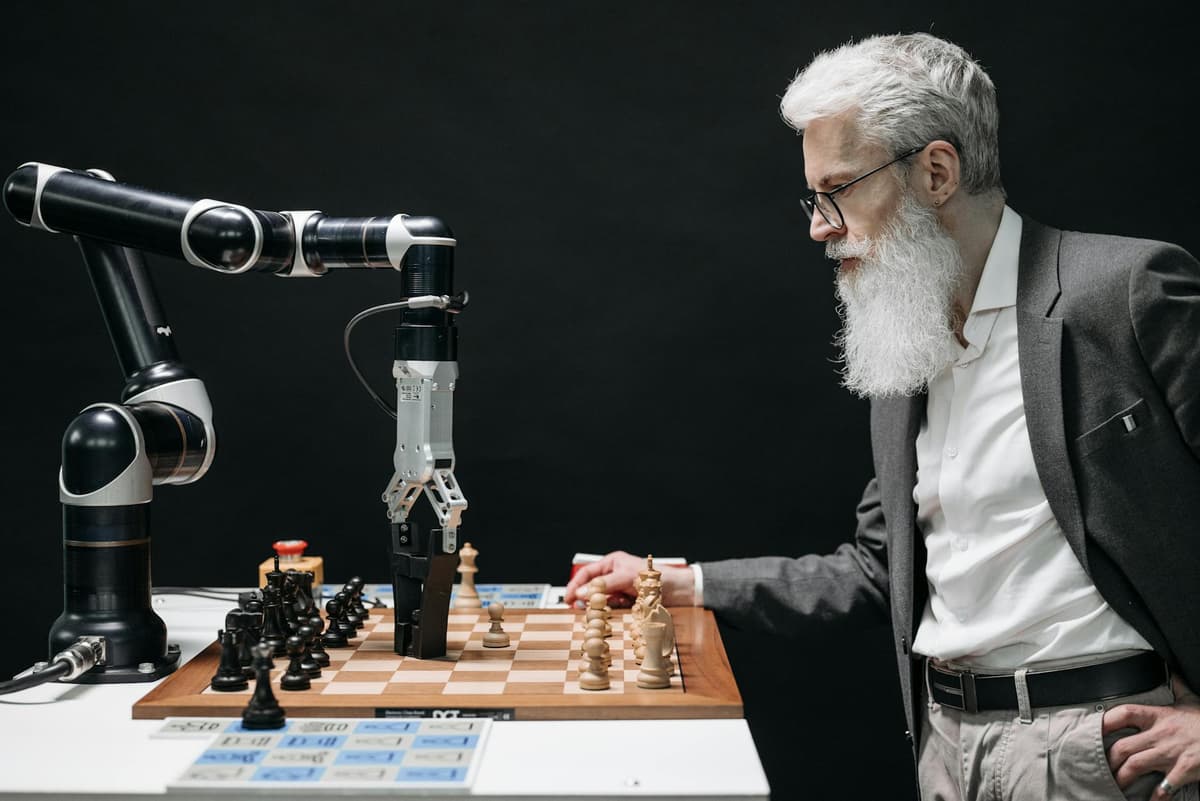 man plaing chess with a robot