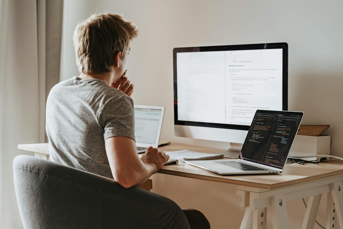 man sitting in front of a computer
